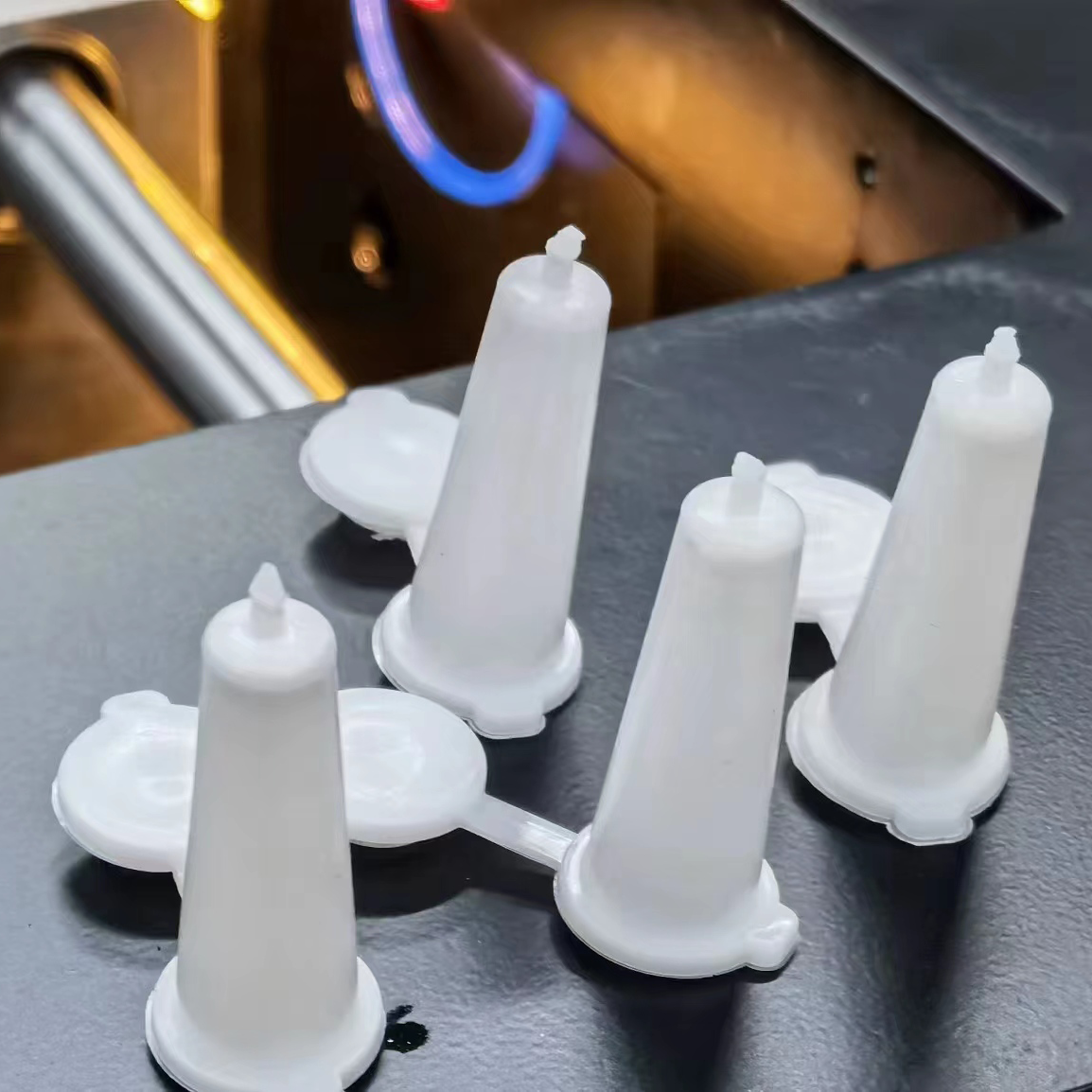 Conical seed bottle injection molded part produced by desktop injection molding machine