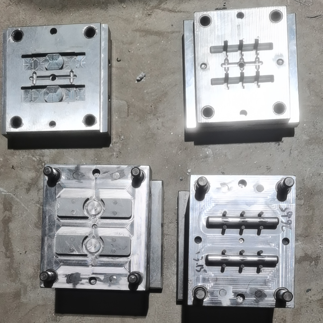 Injection mold open view display showing molded part and mold cavity